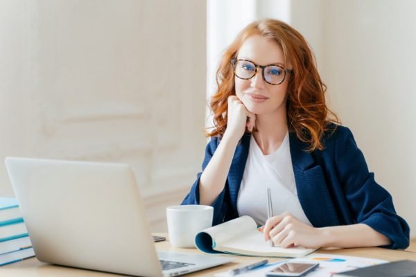 redhead-curly-woman-office-worker-analyzes-data-makes-accounting-report-poses-in-coworking-office.jpg redhead-curly-woman-office-worker-analyzes-data-makes-accounting-report-poses-in-coworking-office.jpg